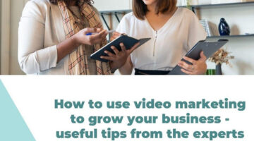 Two businesswomen talking while using black iPad