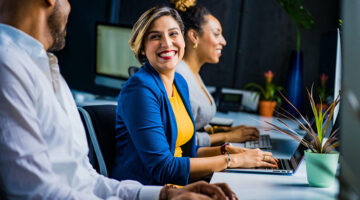 Smiling business woman in blue suit jacket