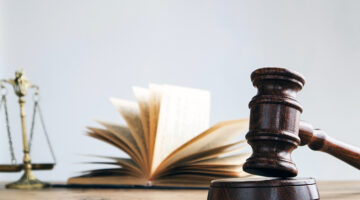 Law books on lawyer desk at law firm