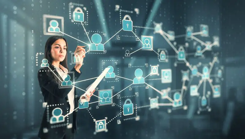 Attractive Young Caucasian Businesswoman Using Glowing People Interface Hologram On Blurry Office