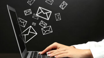 Email concept with laptop and hands