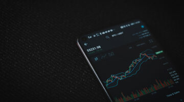 Black android smartphone on black textile