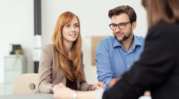 Young couple talking to a business consultant