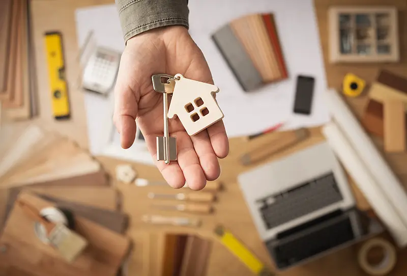 Real estate agent handing over a house key