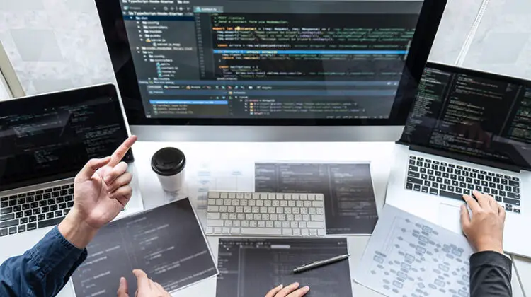Team of developer programmer working on project in software development