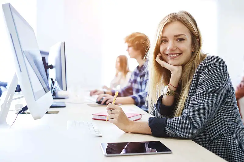 Young female student in front of computer