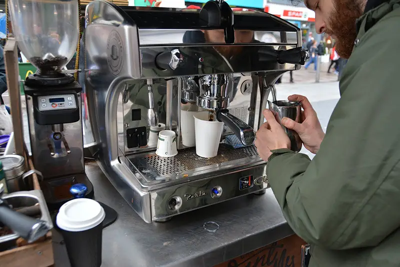 Man making coffee at coffee shop coffee stand