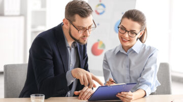 Young managers discussing issues in office