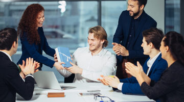 Colleagues receiving gifts in the office