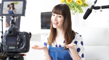 Female Vlogger Recording Broadcast At Home