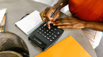 Woman uses calculator