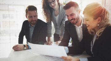 Group of business people collaborating on project in office
