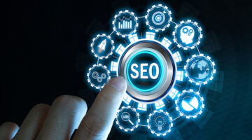 Businessman's fingers pressing a button SEO