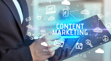 Person Using Social Networking with CONTENT MARKETING inscription