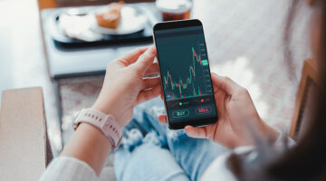 Business woman using smartphone with cryptocurrency money link network concept