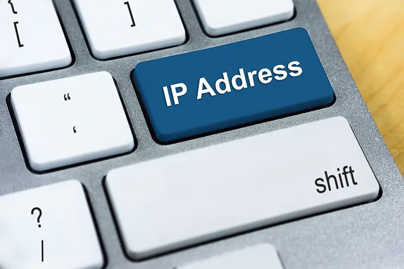 Written word IP Address on blue keyboard button