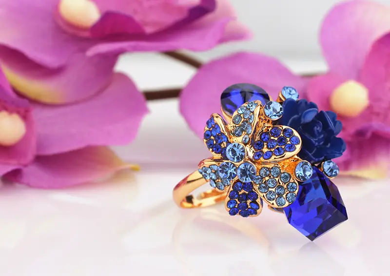 Jewellery ring with blue gems and flower 