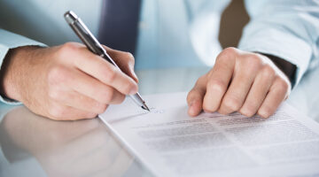 Businessman is signing a contract