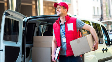 Courier Delivering Package By Van