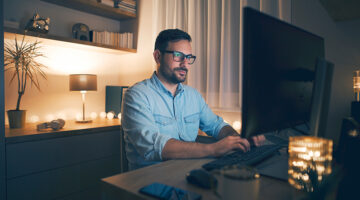 Modern young man working remotely from home