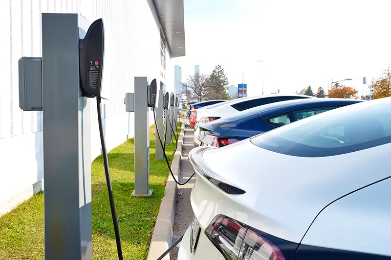 Selective focus of Tesla electric cars in a row and recharging
