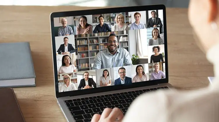 Female employee talk on video call with colleagues