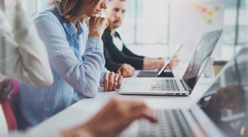 Coworkers working with computers