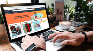 Laptop showing Amazon logo and credit card shopping online
