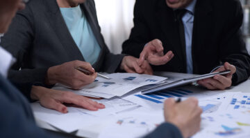 Campaign office workers looking at exit poll results