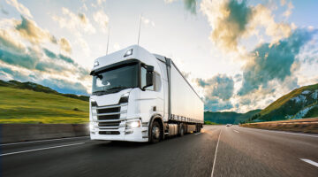 Truck with container on highway