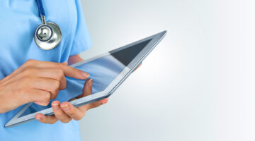 Doctor touching the iPad