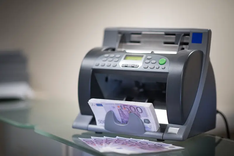 Banknote counter is counting euro banknotes 