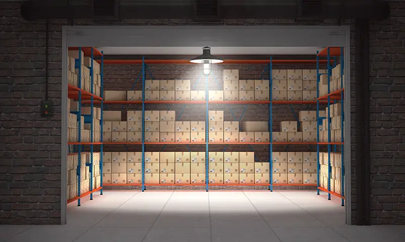 Open self storage unit full of cardboard boxes