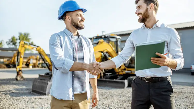 Builder shaking hands with his contractor