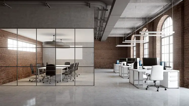 Open space office interior with brick and glass wall