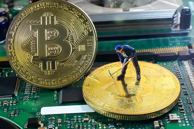 A little miner is digging for bitcoin