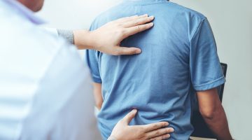 Doctor consulting with patient Back problems