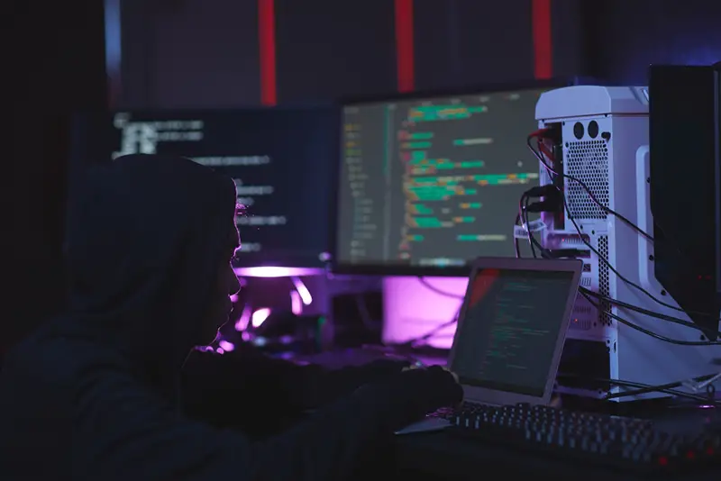 Unrecognizable Hacker in Dark