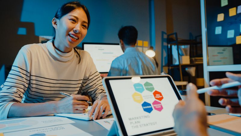 Asia businesspeople meeting plan analysis statistics brainstorm in modern home office night.