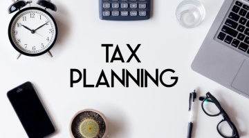 Tax planning words written on white table
