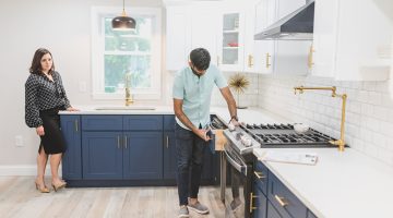 A man inspecting the kitchen drawer