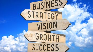 Wooden signpost - business growth