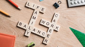 Words work life balance and family on table collected with wooden cubes