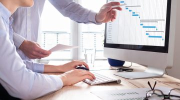 Project management team updating the gantt chart