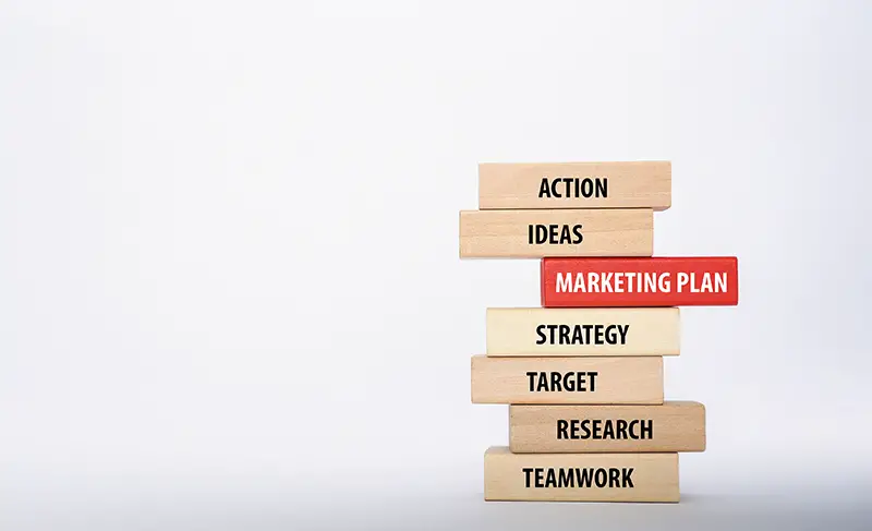 MARKETING PLAN concept with Wooden Blocks