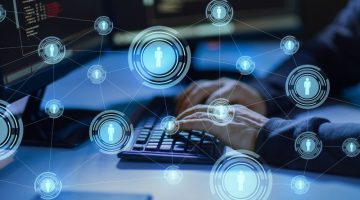 Cybercrime, Hacking And Technology Concept - Hands Of Hacker In Dark Room Writing Code