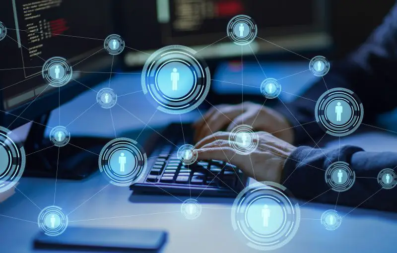 Cybercrime, Hacking And Technology Concept - Hands Of Hacker In Dark Room Writing Code