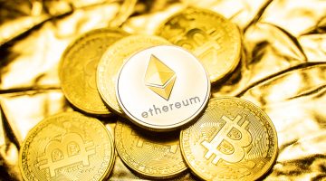 Gold ethereum coins on a golden background