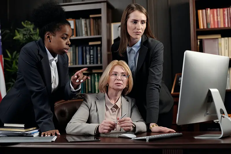 Female lawyer in the office looking at the computer
