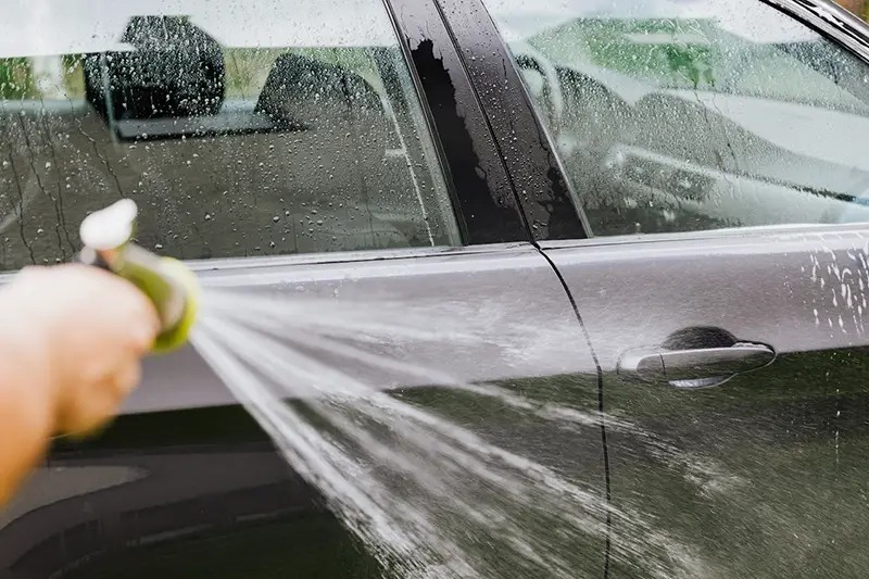 Person washing a car
